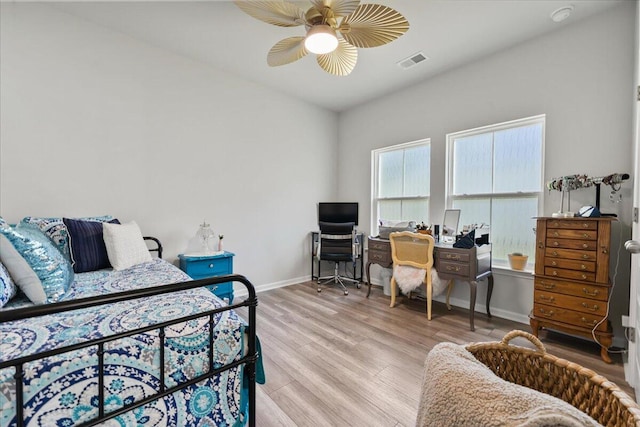 bedroom with ceiling fan and light hardwood / wood-style flooring