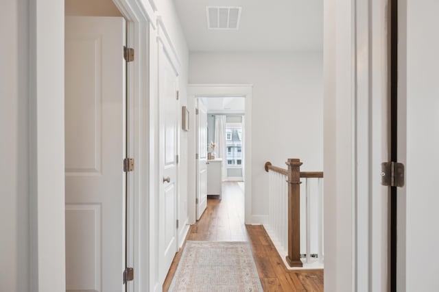 hall with light hardwood / wood-style floors