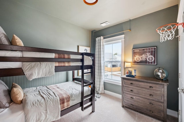 bedroom featuring light carpet