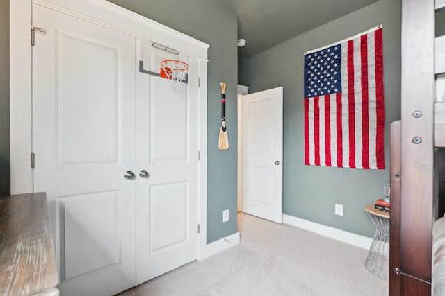 carpeted bedroom with a closet