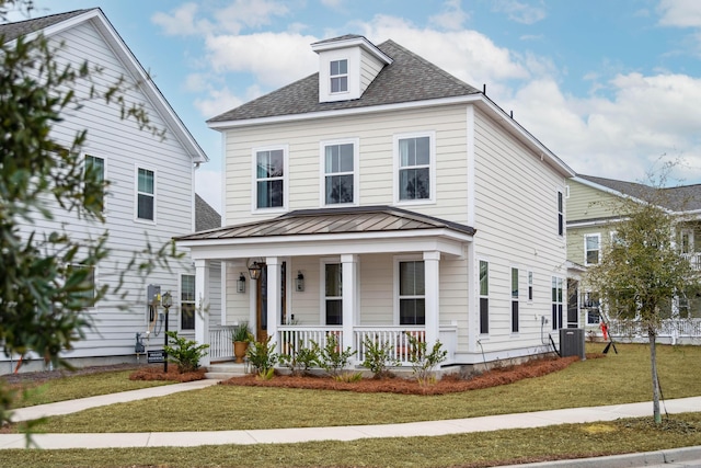 view of front of home featuring a porch, central air condition unit, and a front lawn