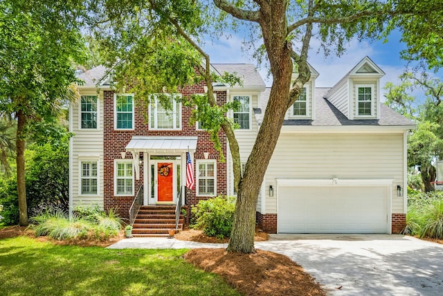 174 Revetment Ln, Mount Pleasant, SC 29464 - georgian-style home with driveway, brick siding, and a shingled roof