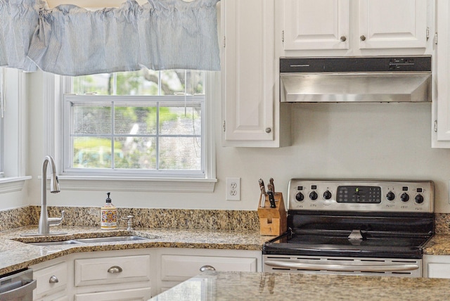 174 Revetment Ln, Mount Pleasant, SC 29464 - kitchen featuring appliances with stainless steel finishes, under cabinet range hood, a sink, white cabinets, and light stone countertops