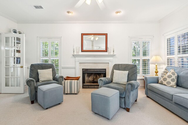 174 Revetment Ln, Mount Pleasant, SC 29464 - living room featuring carpet floors, crown molding, ceiling fan, and a fireplace