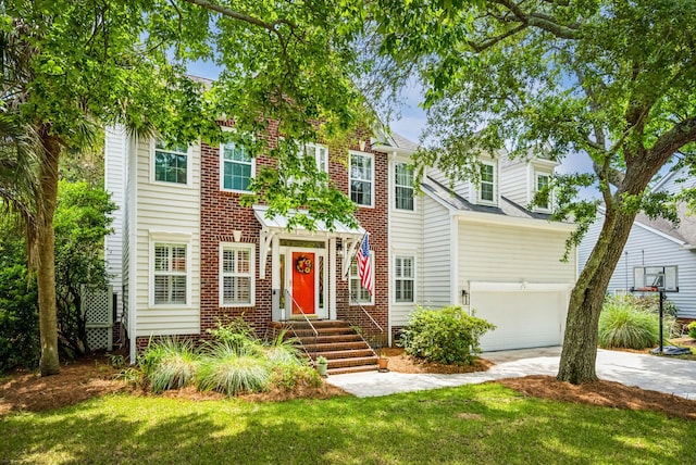 174 Revetment Ln, Mount Pleasant, SC 29464 - view of front of house featuring driveway, an attached garage, a front yard, and brick siding