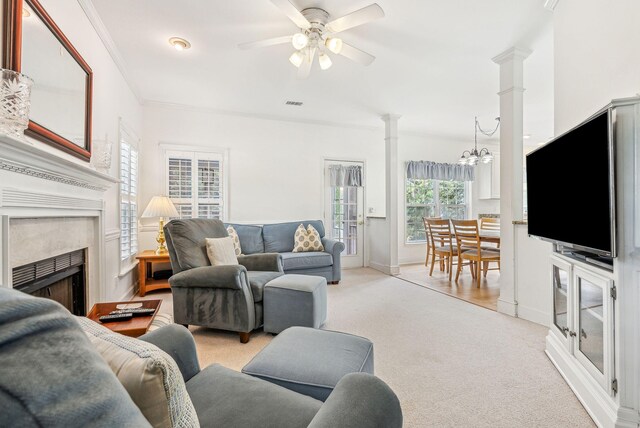 174 Revetment Ln, Mount Pleasant, SC 29464 - living area featuring decorative columns, light carpet, ceiling fan, a fireplace, and baseboards