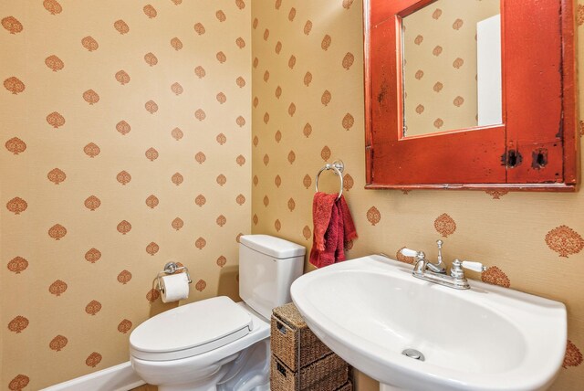 174 Revetment Ln, Mount Pleasant, SC 29464 - half bathroom with wallpapered walls, a sink, and toilet
