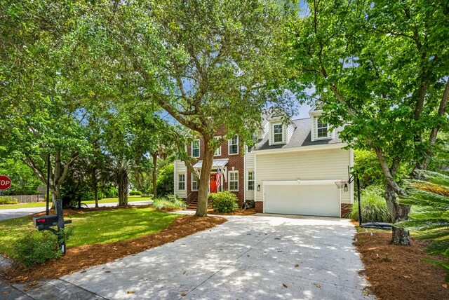 174 Revetment Ln, Mount Pleasant, SC 29464 - view of front facade with concrete driveway, a garage, and a front lawn