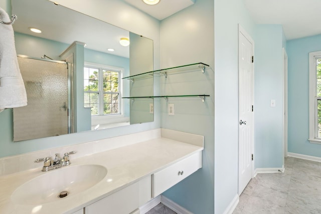 174 Revetment Ln, Mount Pleasant, SC 29464 - bathroom featuring healthy amount of natural light, a stall shower, vanity, and baseboards