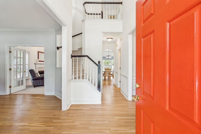 174 Revetment Ln, Mount Pleasant, SC 29464 - entryway featuring light wood finished floors, stairway, ornamental molding, a chandelier, and baseboards