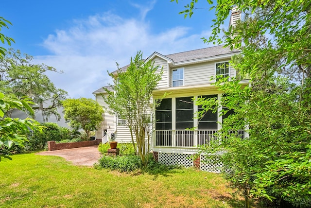 174 Revetment Ln, Mount Pleasant, SC 29464 - rear view of house with a patio area, a yard, and a sunroom
