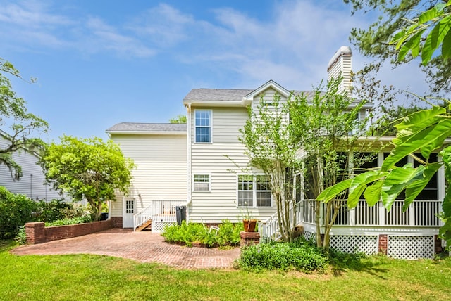 174 Revetment Ln, Mount Pleasant, SC 29464 - rear view of property with a yard, a chimney, and a patio area