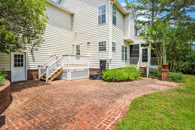 174 Revetment Ln, Mount Pleasant, SC 29464 - back of property featuring a sunroom, a patio, a deck, and stairs
