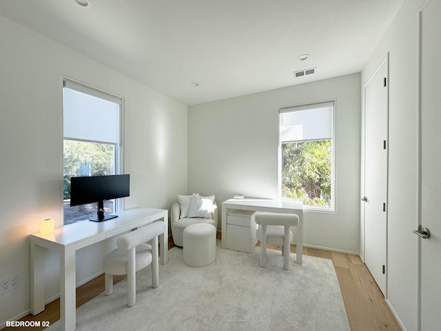 office area with light hardwood / wood-style flooring