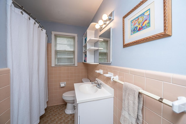 2567 Mona Ave, Charleston, SC 29414 - bathroom with tile walls, vanity, toilet, wainscoting, and a shower with curtain