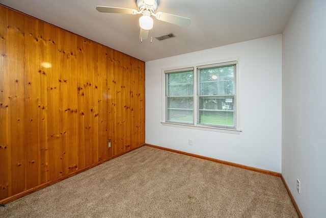 2567 Mona Ave, Charleston, SC 29414 - carpeted empty room featuring baseboards, ceiling fan, and wooden walls