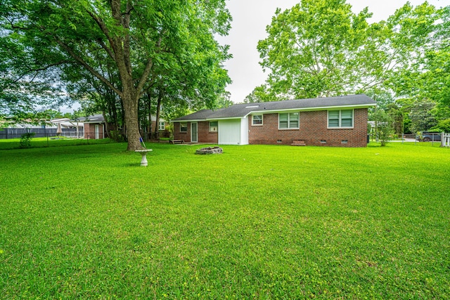 2567 Mona Ave, Charleston, SC 29414 - view of yard featuring an outdoor fire pit