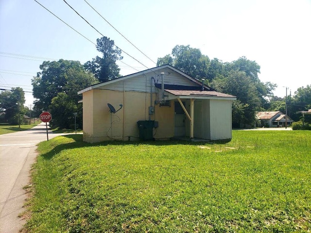 view of home's exterior featuring a yard