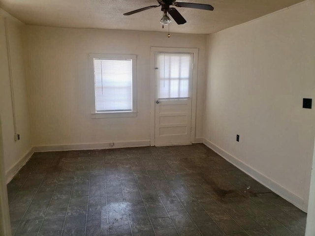 empty room featuring ceiling fan