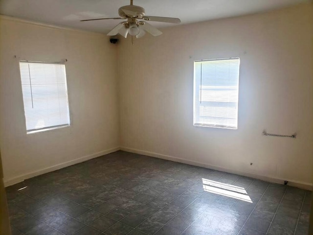 unfurnished room with ceiling fan