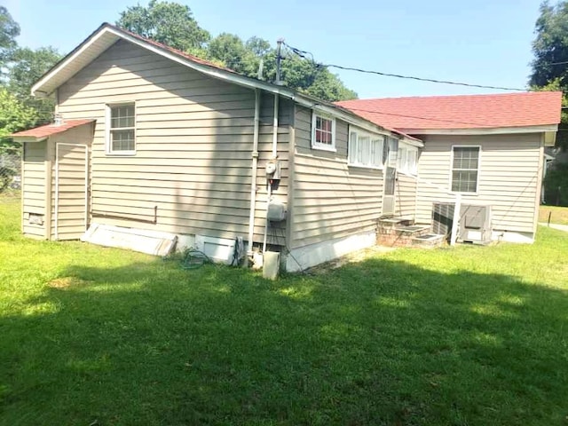 view of property exterior featuring a yard