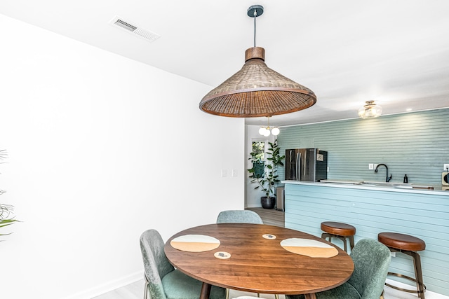 dining room featuring sink