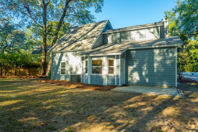 back of house with a yard