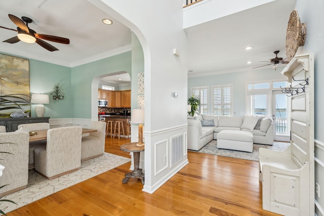 68 W 9th St Unit B, Folly Beach, SC 29439 - living room featuring arched walkways, crown molding, a ceiling fan, and recessed lighting
