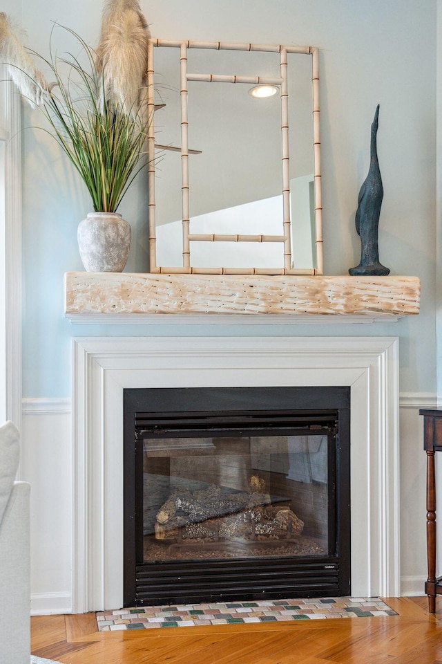 68 W 9th St Unit B, Folly Beach, SC 29439 - details with a fireplace with flush hearth, wood finished floors, and baseboards