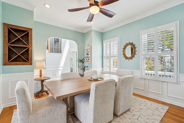 68 W 9th St Unit B, Folly Beach, SC 29439 - dining space with wood finished floors, a healthy amount of sunlight, and a wainscoted wall