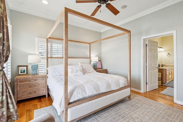68 W 9th St Unit B, Folly Beach, SC 29439 - bedroom featuring ornamental molding, wood finished floors, ensuite bathroom, and a sink