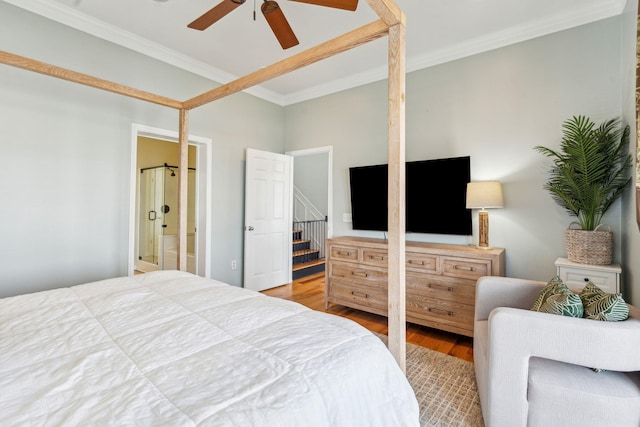 68 W 9th St Unit B, Folly Beach, SC 29439 - bedroom with ceiling fan, wood finished floors, connected bathroom, and ornamental molding
