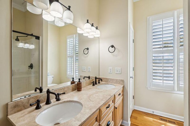 68 W 9th St Unit B, Folly Beach, SC 29439 - full bathroom with visible vents, toilet, a stall shower, and a sink