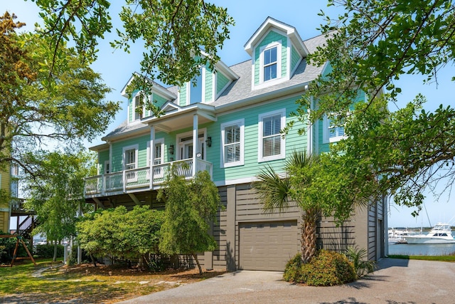 68 W 9th St Unit B, Folly Beach, SC 29439 - view of front of home featuring an attached garage and concrete driveway