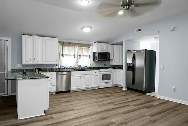 kitchen with kitchen peninsula, white cabinetry, and stainless steel appliances