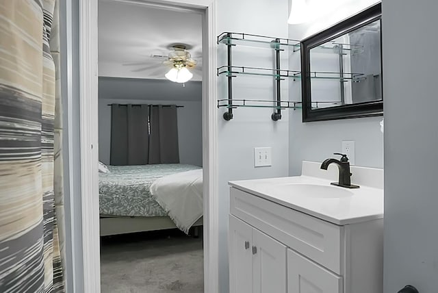 bathroom featuring vanity, ceiling fan, and concrete floors