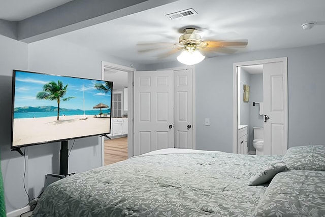 bedroom featuring ceiling fan and ensuite bathroom