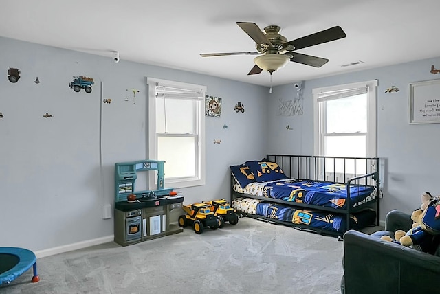 carpeted bedroom featuring ceiling fan