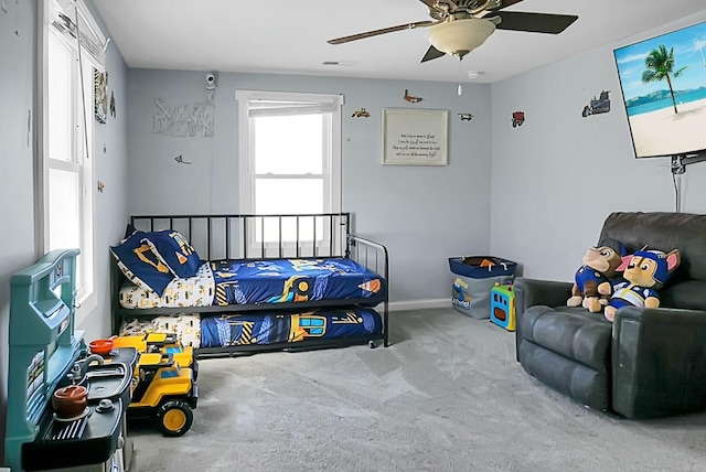 bedroom with ceiling fan and carpet