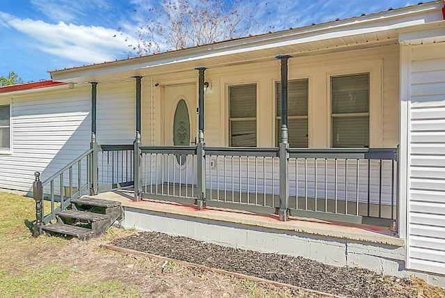 property entrance with covered porch