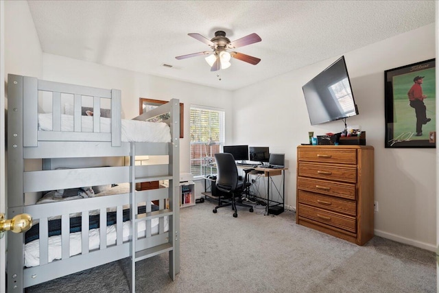 bedroom with carpet floors and a textured ceiling