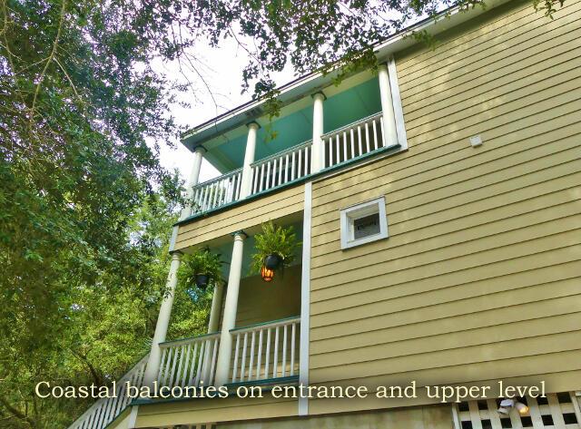 view of side of property with a balcony