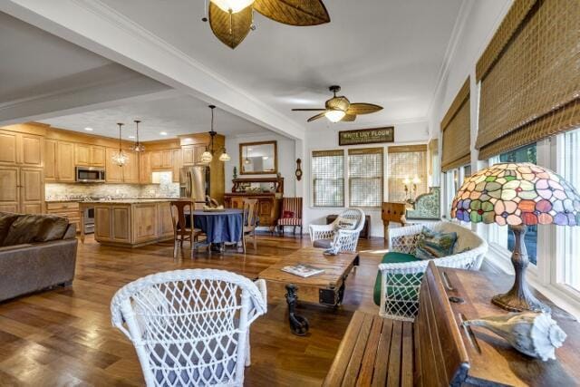 living room featuring crown molding, hardwood / wood-style flooring, and ceiling fan