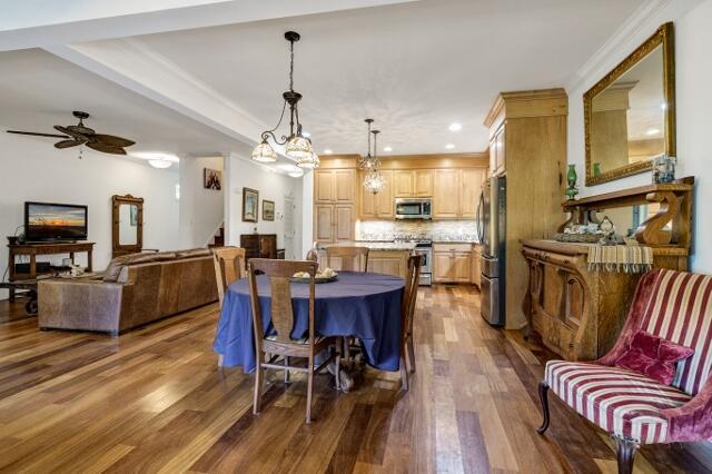 dining area featuring dark hardwood / wood-style floors and ceiling fan