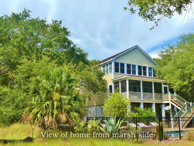 back of house featuring a fenced in pool and a sunroom