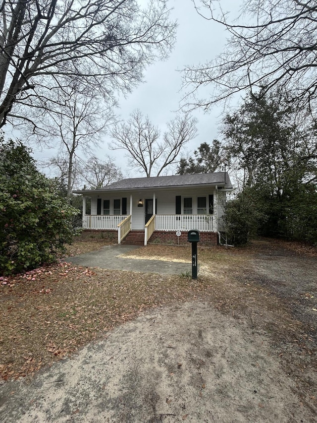 view of front of property featuring covered porch