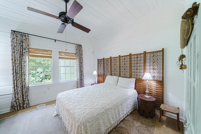 bedroom with ceiling fan and hardwood / wood-style floors