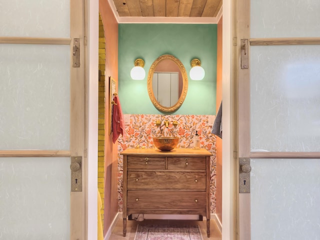 bathroom featuring wooden ceiling and vanity