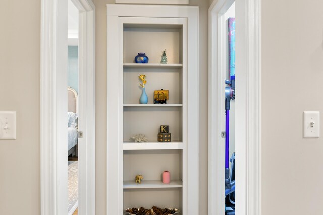 hallway featuring built in shelves