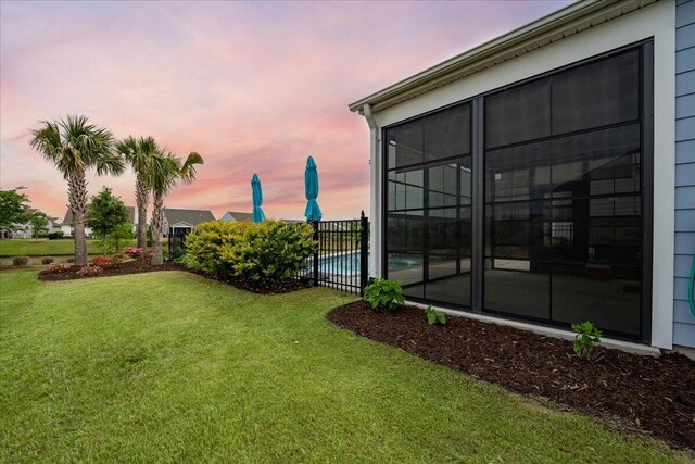 view of yard at dusk